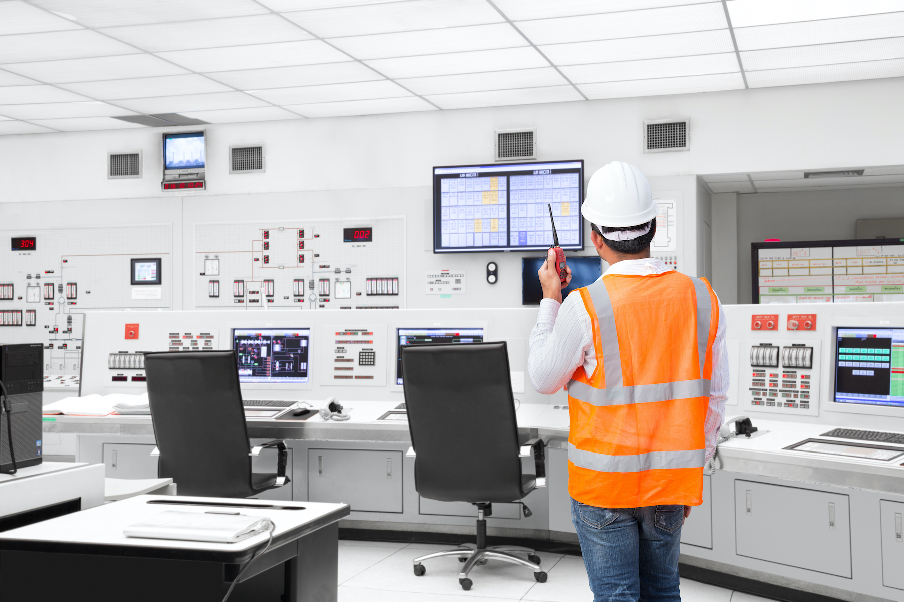 Electrical engineer working at control room of a modern thermal power plant