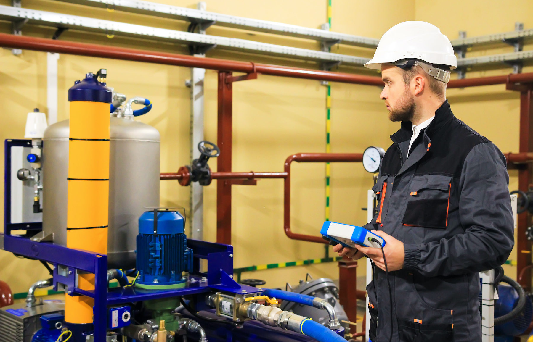 Technician engineer adjusts plumbing systems