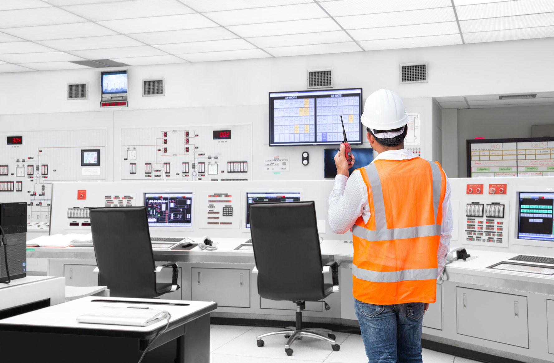 Electrical engineer working at control room of a modern thermal power plant