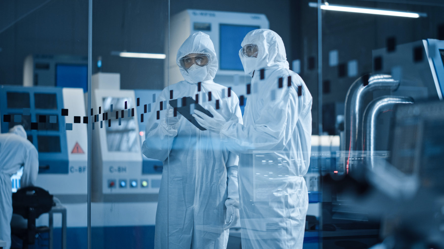 Scientists working in lab wearing protective gear