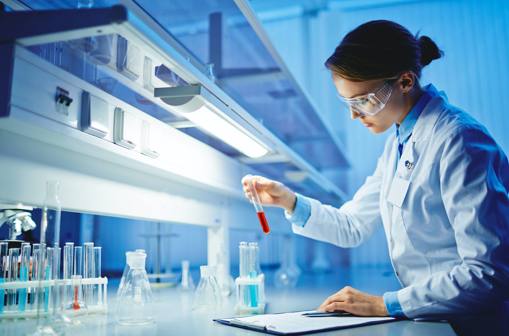 Scientist working with liquids in glassware