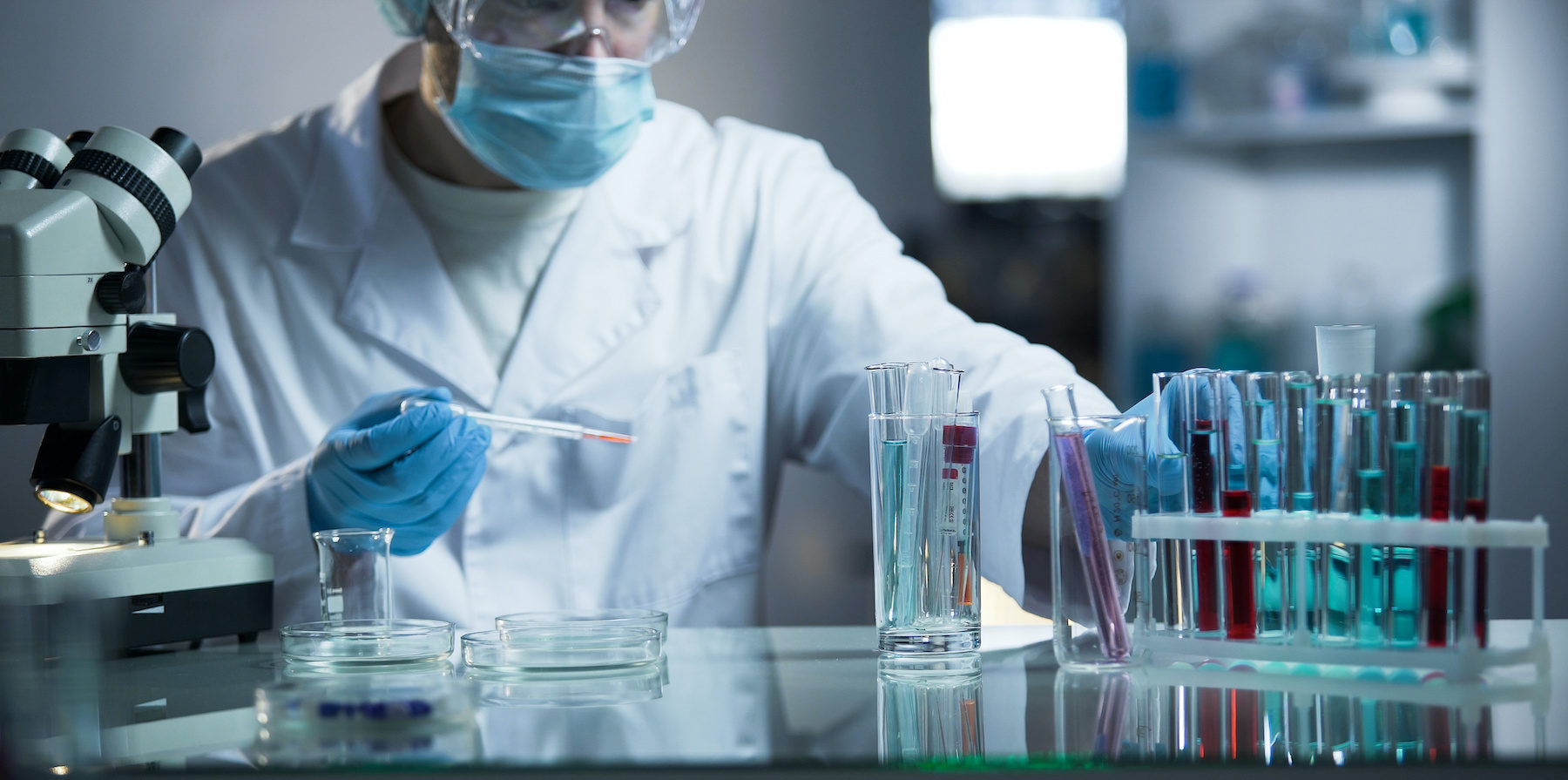 Medical lab assistant taking genetic material for examination