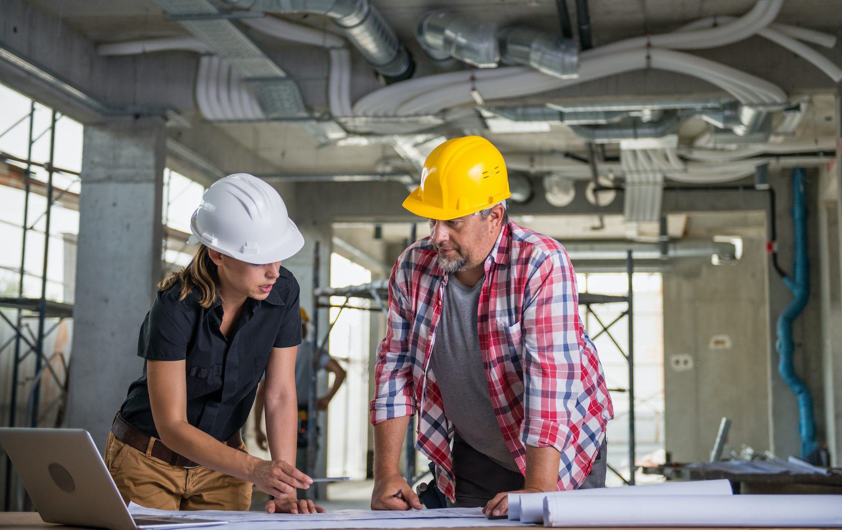 Engineer with construction worker