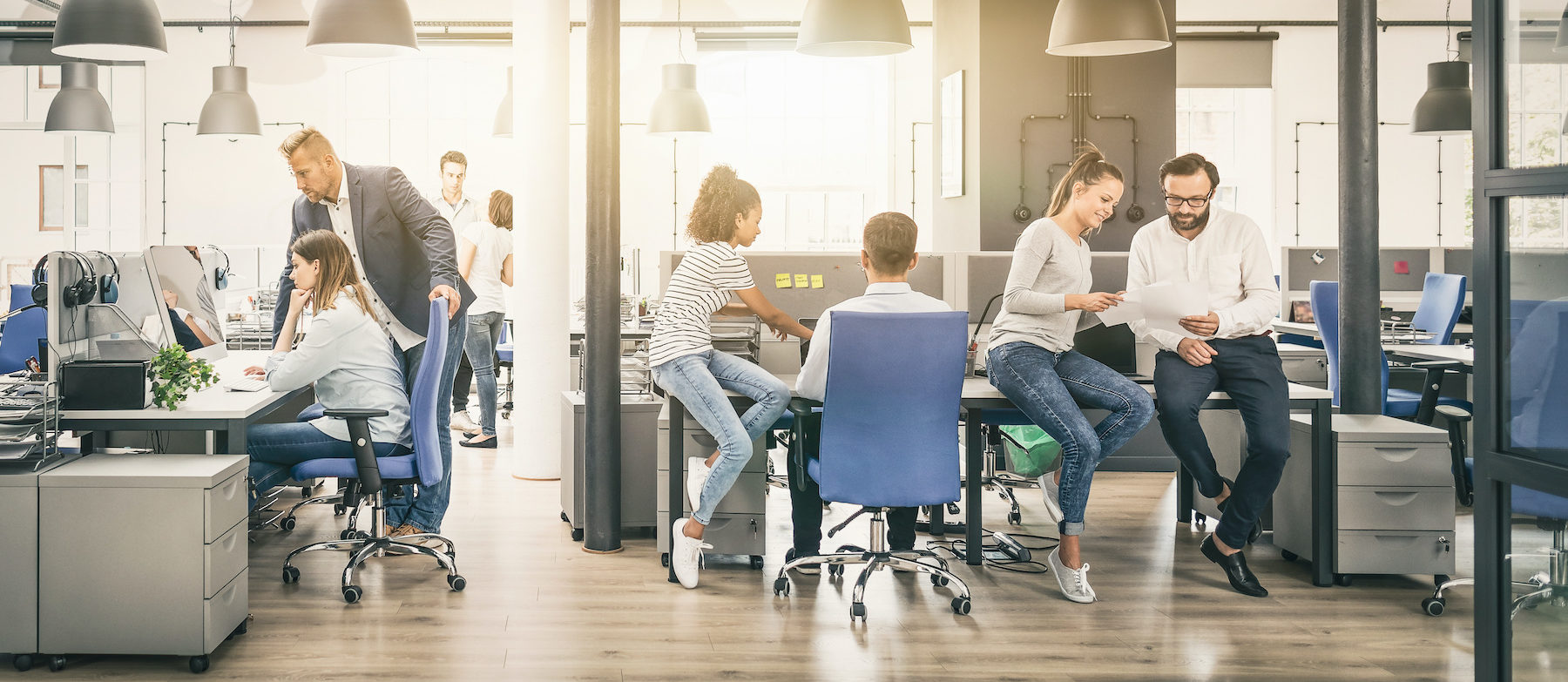 Team at work. Group of young business people working together in creative modern office.